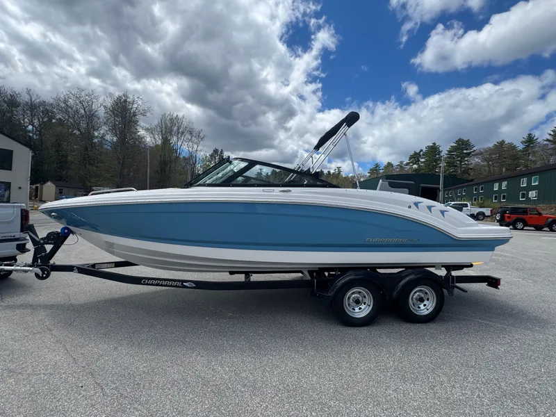 Slide: The Image of 2026 Chaparral 23 SSi boat on trailer under cloudy sky. - 5