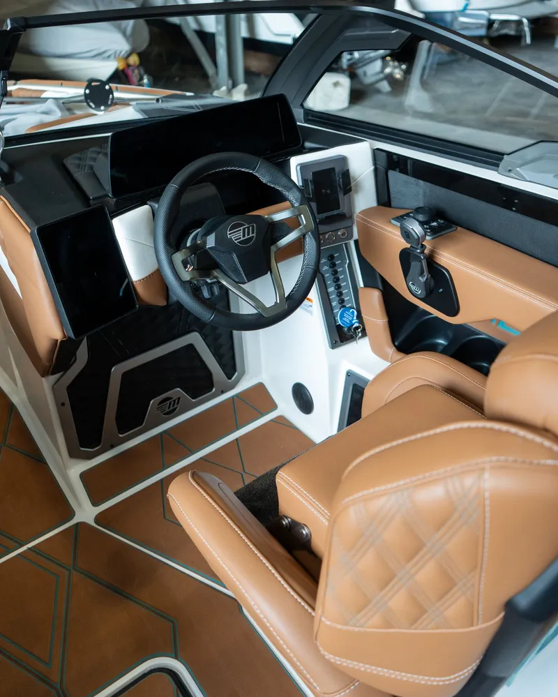 Slide: The Image of Interior of 2026 Malibu M230 featuring modern design and brown leather seats. - 4