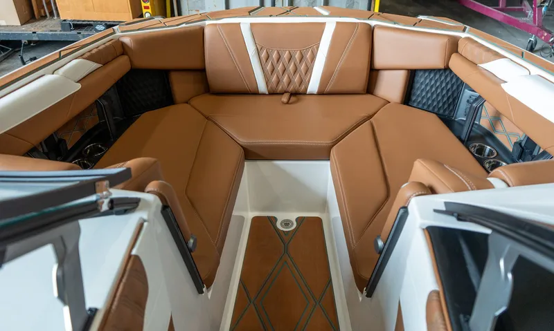 Slide: The Image of Interior of 2026 Malibu M230 with luxurious brown leather seating. - 7