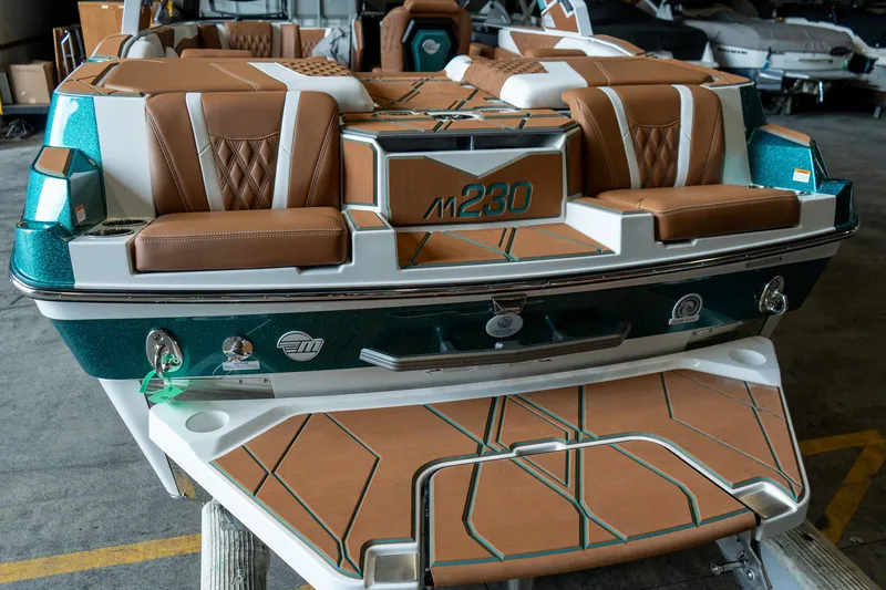 Slide: The Image of Rear view of 2026 Malibu M230 boat with luxurious interior. - 8