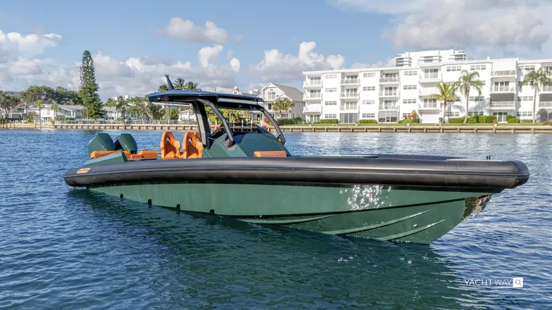 Slide: The Image of 2025 Skipper-BSK 38 boat on water, modern design, near waterfront buildings. - 28