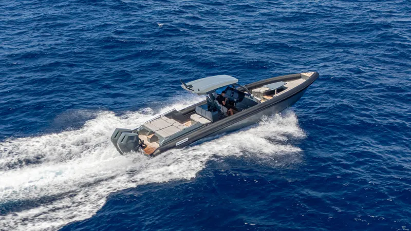 Slide: The Image of 2025 Skipper-BSK 38 boat cruising on open blue sea, aerial view. - 12