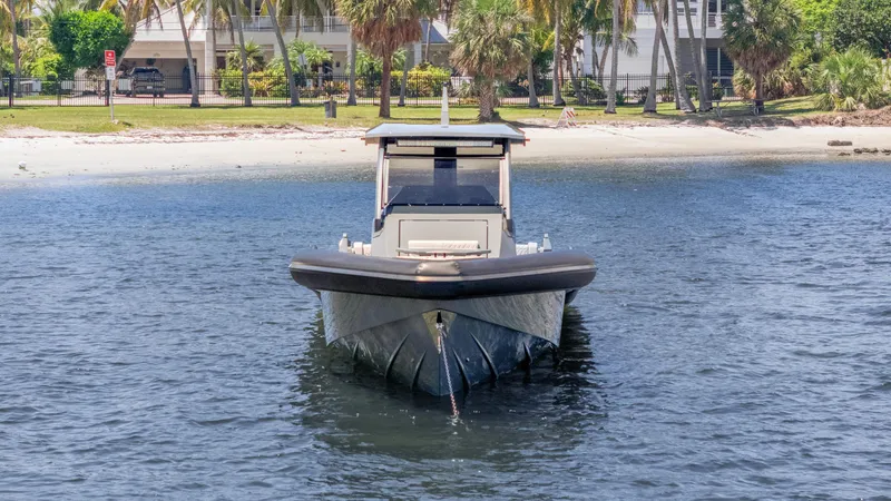 Slide: The Image of Front view of a 2025 Skipper-BSK 38 boat near a sandy beach. - 35