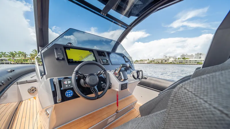 Slide: The Image of Interior view of 2025 Skipper-BSK 38 boat cockpit with modern navigation equipment. - 4