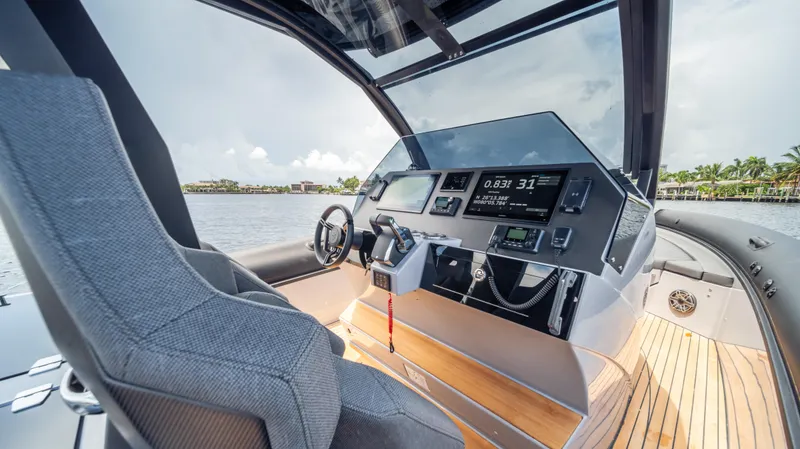 Slide: The Image of Helm of 2025 Skipper-BSK 38 boat with modern controls and sleek design. - 8