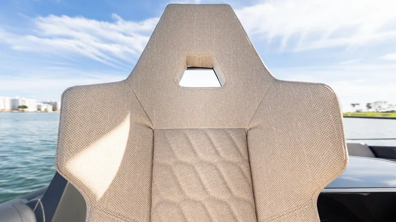 Slide: The Image of Modern Skipper-BSK 38 boat seat, 2025 model, with geometric design and waterfront view. - 16