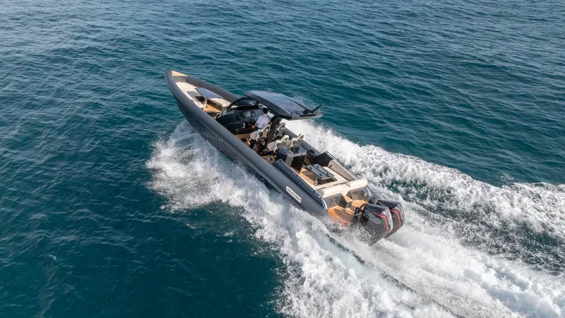 Slide: The Image of 2025 Skipper 38 boat cruising on open water, showcasing sleek design and powerful performance. - 39