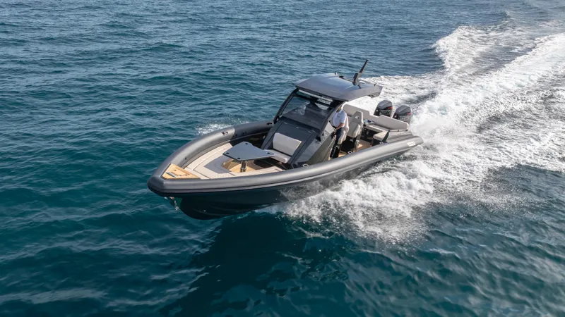 Slide: The Image of 2025 Skipper 38 boat cruising on open water, showcasing sleek design and performance. - 34