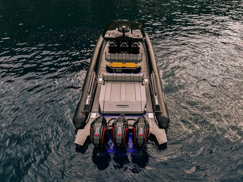 Slide: The Image of Skipper-BSK 42 boat, 2026 model, with triple outboard engines on water. - 7