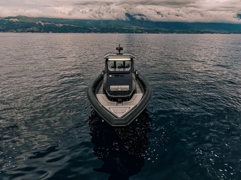 Slide: The Image of Skipper-BSK 42 boat on calm sea with mountainous backdrop, 2026 model. - 8
