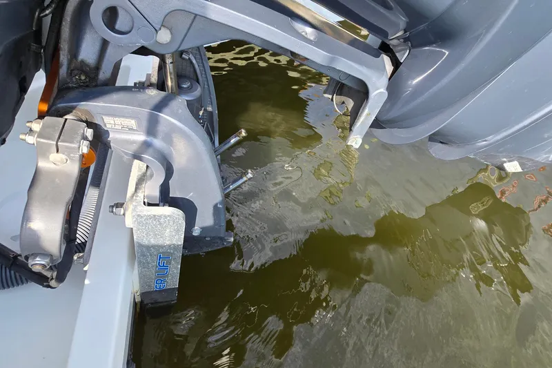 Slide: The Image of 2023 Jeanneau NC Sport 795 Series 2 boat engine detail in water. - 15