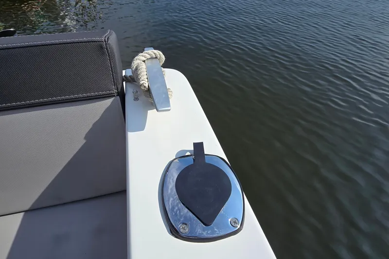 Slide: The Image of 2023 Jeanneau NC Sport 795 Series 2 boat detail with cleat and water view. - 16