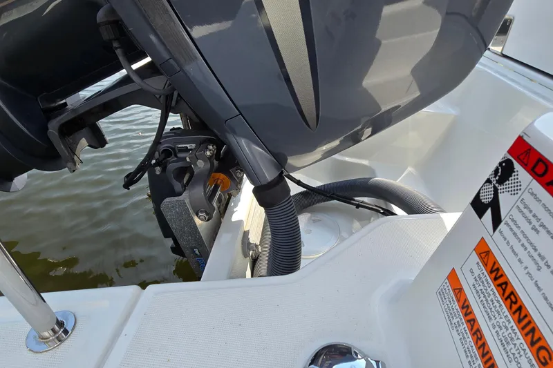 Slide: The Image of 2023 Jeanneau NC Sport 795 Series 2 boat engine and warning labels. - 20