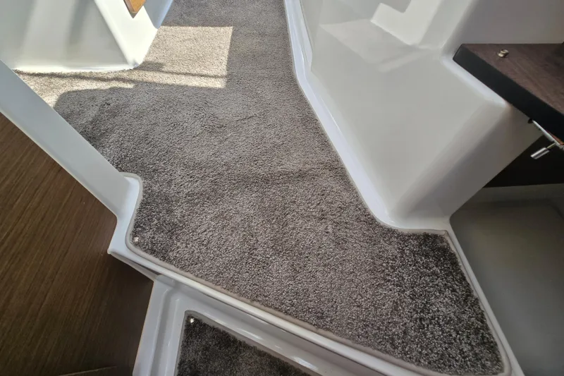 Slide: The Image of Carpeted interior of 2023 Jeanneau NC Sport 795 Series 2 boat. - 38