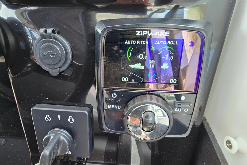 Slide: The Image of Control panel of 2023 Jeanneau NC Sport 795 Series 2 with Zipwake auto pitch and roll display. - 45