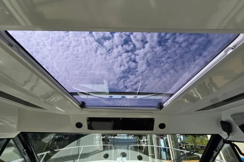 Slide: The Image of 2023 Jeanneau NC Sport 795 Series 2 boat interior with panoramic sunroof view. - 47