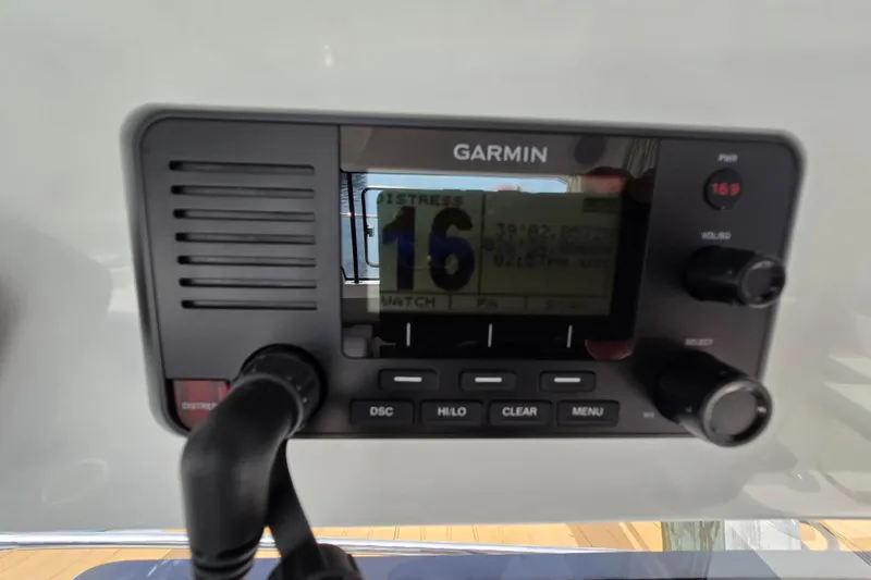 Slide: The Image of Garmin marine radio on 2023 Jeanneau NC Sport 795 Series 2 boat dashboard. - 48
