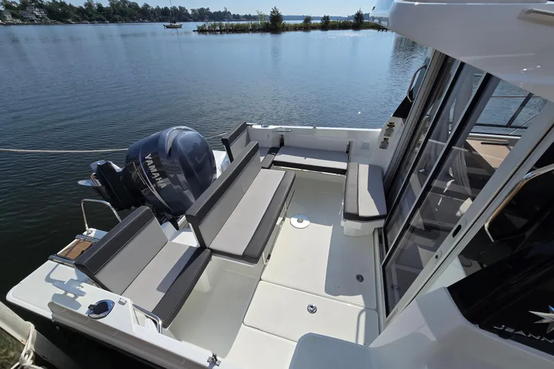 Slide: The Image of 2023 Jeanneau NC Sport 795 Series 2 boat with Yamaha engine on a serene lake. - 5