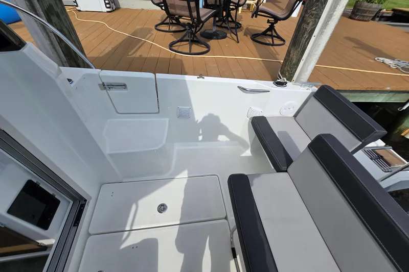 Slide: The Image of 2023 Jeanneau NC Sport 795 Series 2 boat interior with seating and deck view. - 50