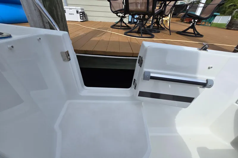 Slide: The Image of 2023 Jeanneau NC Sport 795 Series 2 boat with open deck door, dockside view. - 52