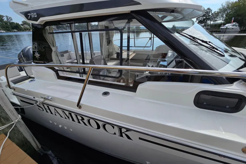 Slide: The Image of 2023 Jeanneau NC Sport 795 Series 2 boat docked, featuring sleek design and spacious interior. - 55