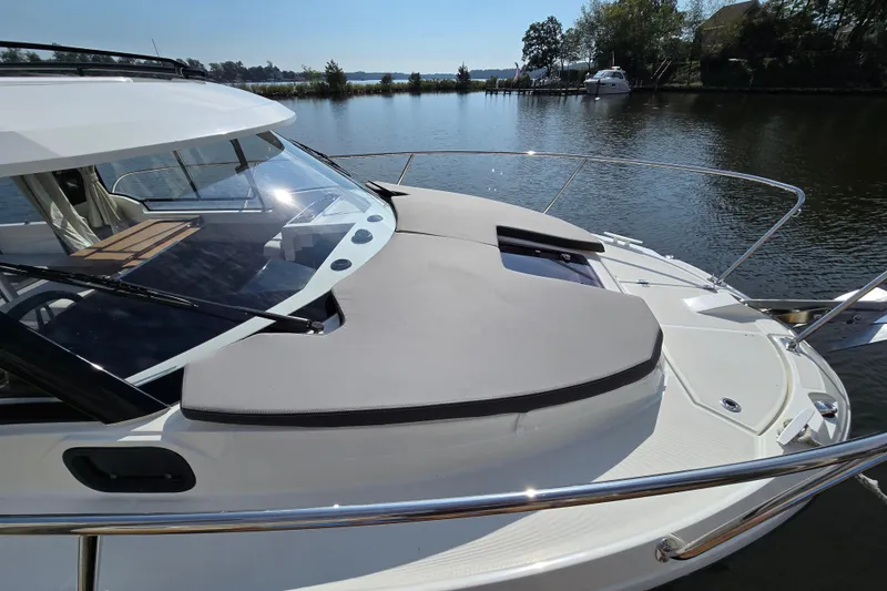 Slide: The Image of 2023 Jeanneau NC Sport 795 Series 2 boat on calm water, featuring sleek design. - 6