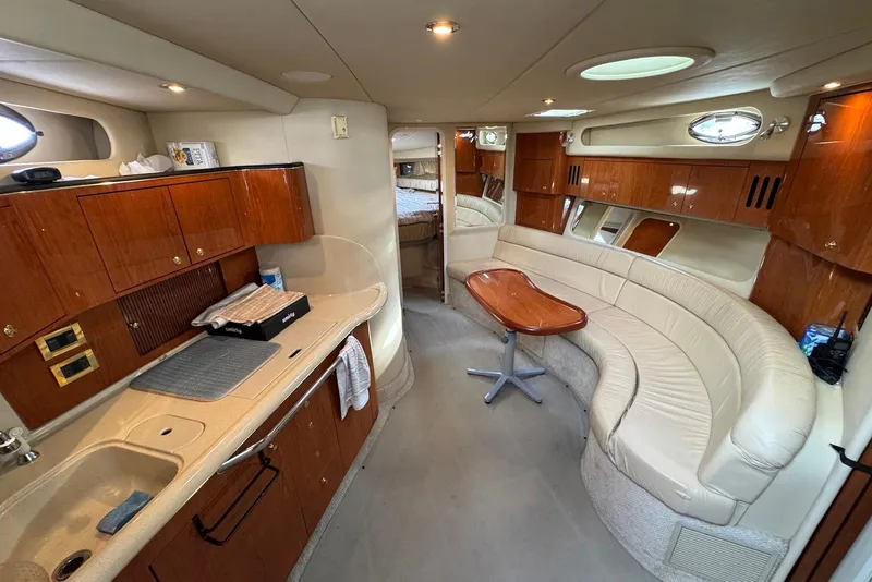 Slide: The Image of Luxurious interior of a 2000 Sea Ray 410 Sundancer yacht with elegant wood finishes. - 13