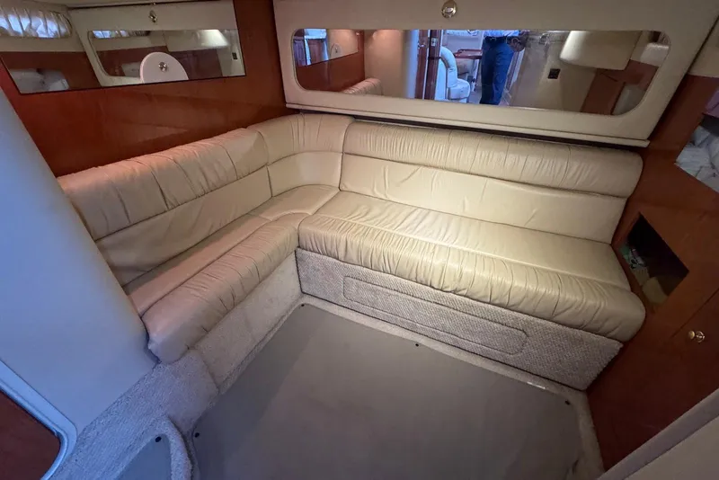 Slide: The Image of Luxurious interior of 2000 Sea Ray 410 Sundancer with beige leather seating. - 20