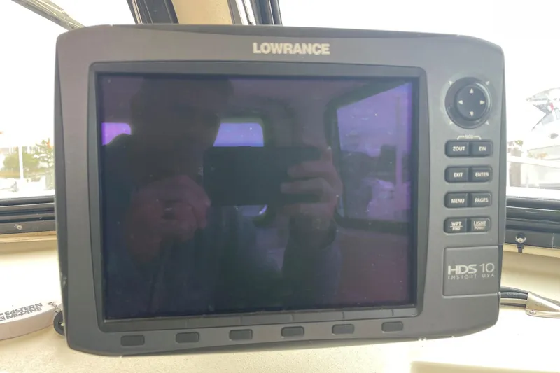 Slide: The Image of Lowrance HDS 10 marine GPS on 2001 Parker 2520 Sport Cabin boat dashboard. - 4