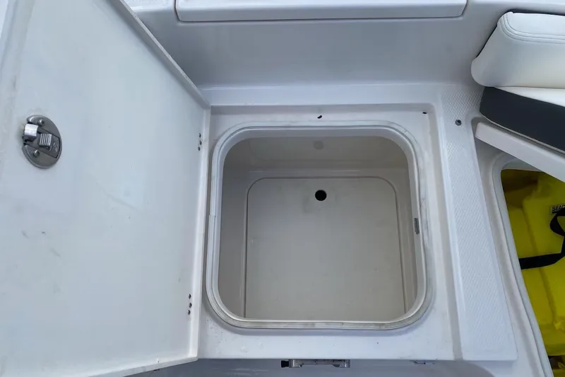 Slide: The Image of Open storage compartment on 2023 Robalo 246 Cayman SD boat. - 20
