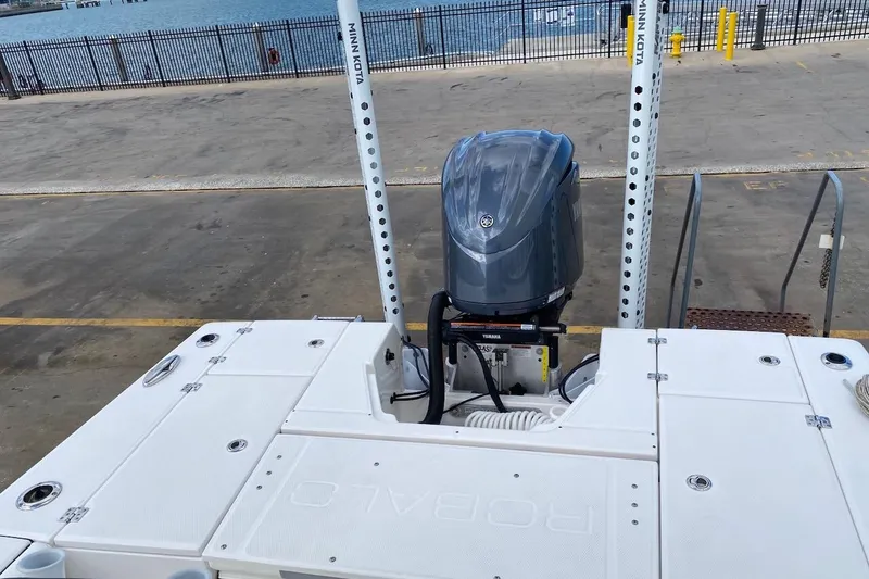 Slide: The Image of 2023 Robalo 246 Cayman SD boat with Yamaha engine at dockside. - 31