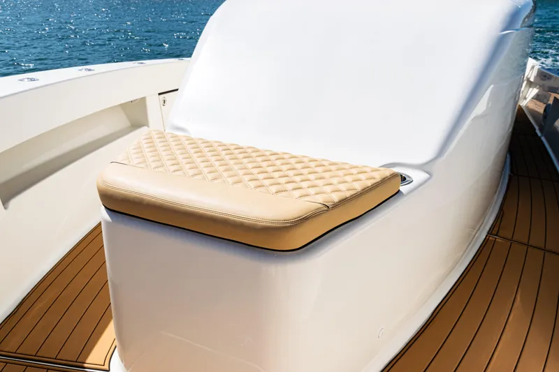 Slide: The Image of Luxurious seating on 2016 SeaVee 430 boat with quilted cushion and teak deck. - 12