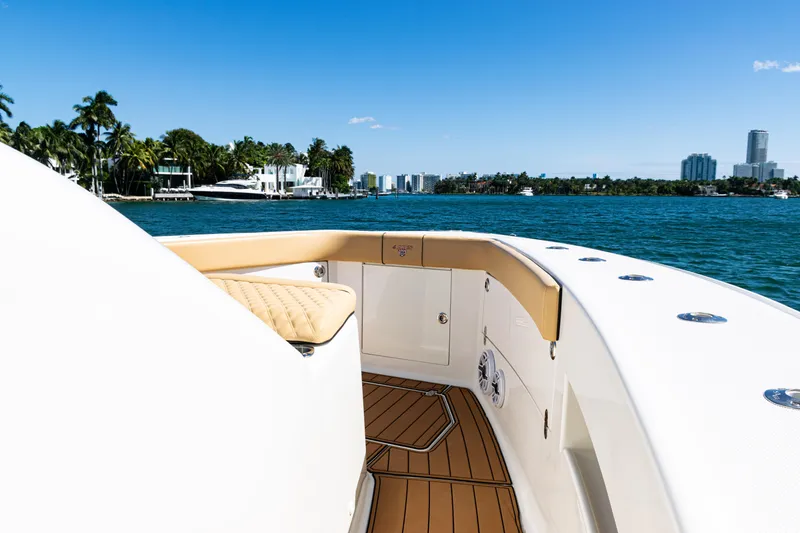 Slide: The Image of 2016 SeaVee 430 boat deck with scenic waterfront view and city skyline. - 15