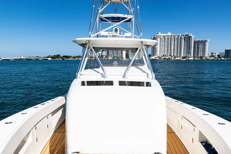 Slide: The Image of 2016 SeaVee 430 boat on water with city skyline in background. - 19