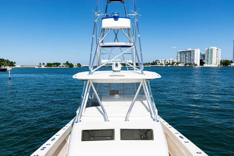 Slide: The Image of 2016 SeaVee 430 boat on water with city skyline in background. - 21