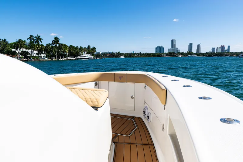 Slide: The Image of 2016 SeaVee 430 boat cruising near city skyline and palm trees. - 24