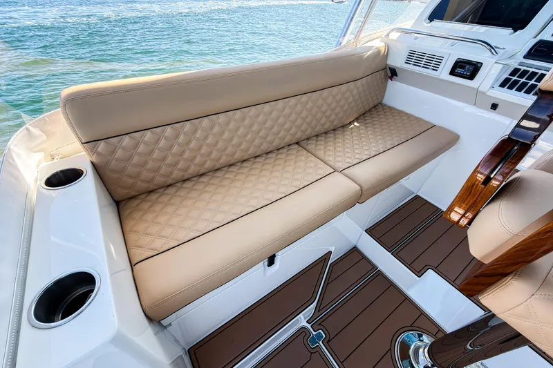 Slide: The Image of Luxurious seating on 2016 SeaVee 430 boat with quilted upholstery and ocean view. - 30