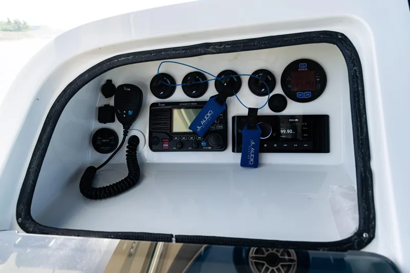 Slide: The Image of Control panel of a 2016 SeaVee 430 boat with audio and communication equipment. - 34