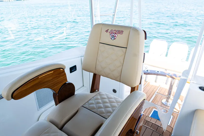 Slide: The Image of Luxurious seating on 2016 SeaVee 430 boat with "4 Aces" embroidery, ocean backdrop. - 35