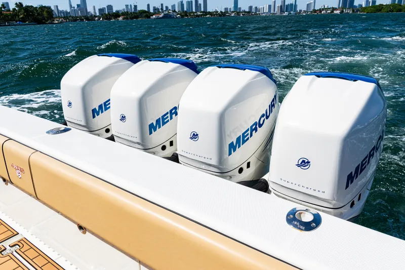 Slide: The Image of 2016 SeaVee 430 boat with four Mercury outboard engines on the water. - 53
