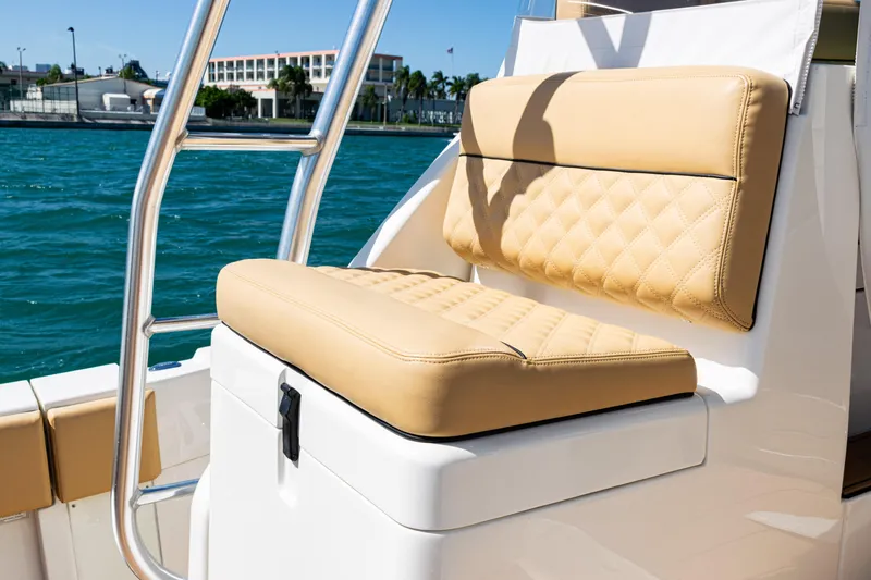 Slide: The Image of Luxurious seating on a 2016 SeaVee 430 boat with quilted tan cushions. - 54