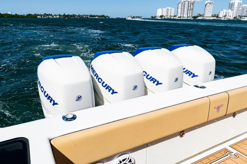 Slide: The Image of 2016 SeaVee 430 boat with four Mercury outboard engines on the ocean. - 62