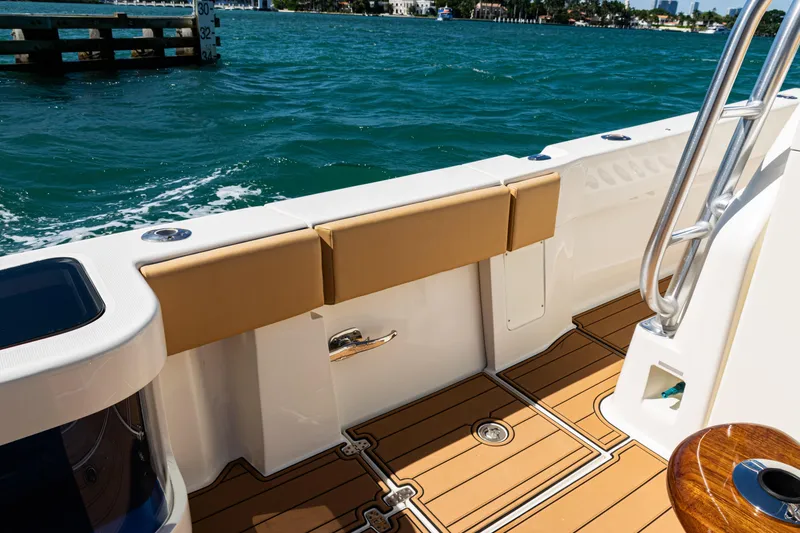 Slide: The Image of 2016 SeaVee 430 boat deck with cushioned seating and ocean view. - 66