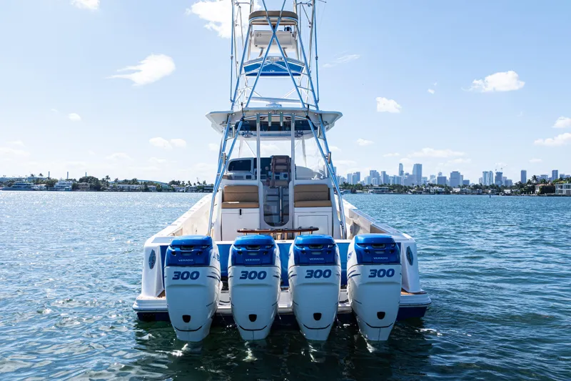 Slide: The Image of 2016 SeaVee 430 boat with four 300 horsepower engines on a sunny day. - 7