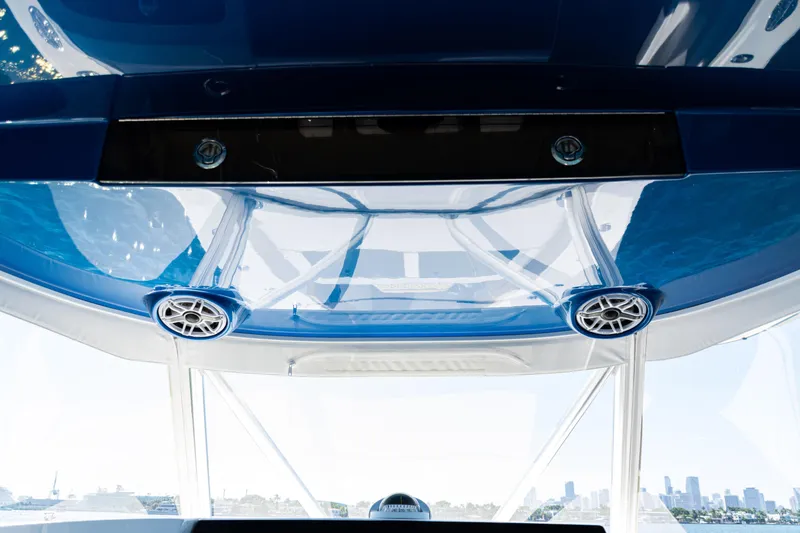 Slide: The Image of 2016 SeaVee 430 boat interior with blue ceiling and speakers. - 76