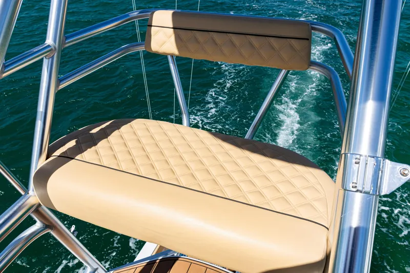 Slide: The Image of 2016 SeaVee 430 boat with tan quilted seat and stainless steel railing on open water. - 82