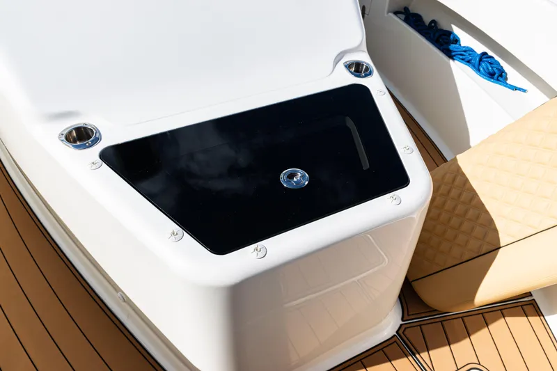 Slide: The Image of 2016 SeaVee 430 boat deck with storage compartment and seating. - 94