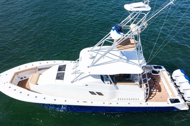 Slide: The Image of 2016 SeaVee 430 boat on water, featuring sleek design and powerful engines. - 95