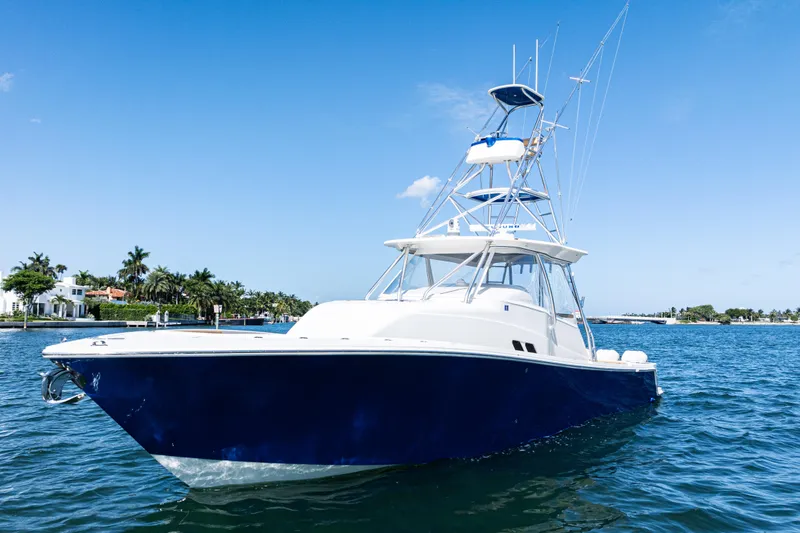 Slide: The Image of 2016 SeaVee 430 boat on blue water under clear sky. - 96