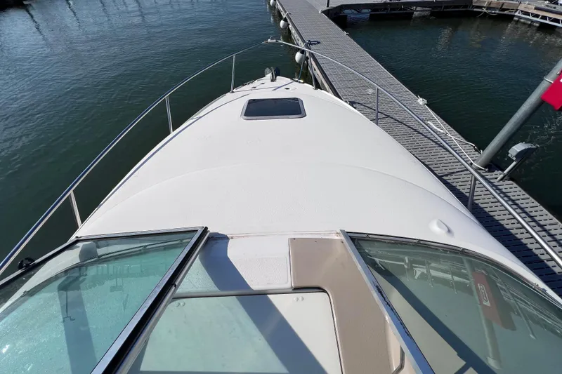 Slide: The Image of 1996 Chaparral 196 SSi boat docked at marina, viewed from the bow. - 12